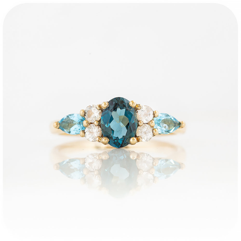 sapphire and topaz anniversary or engagement ring with trellis design in yellow gold