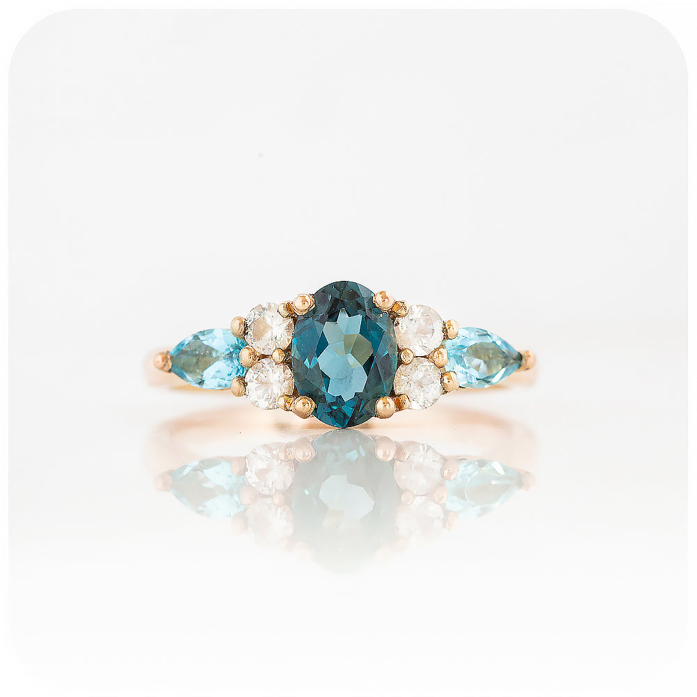 sapphire and topaz anniversary or engagement ring with trellis design in rose gold
