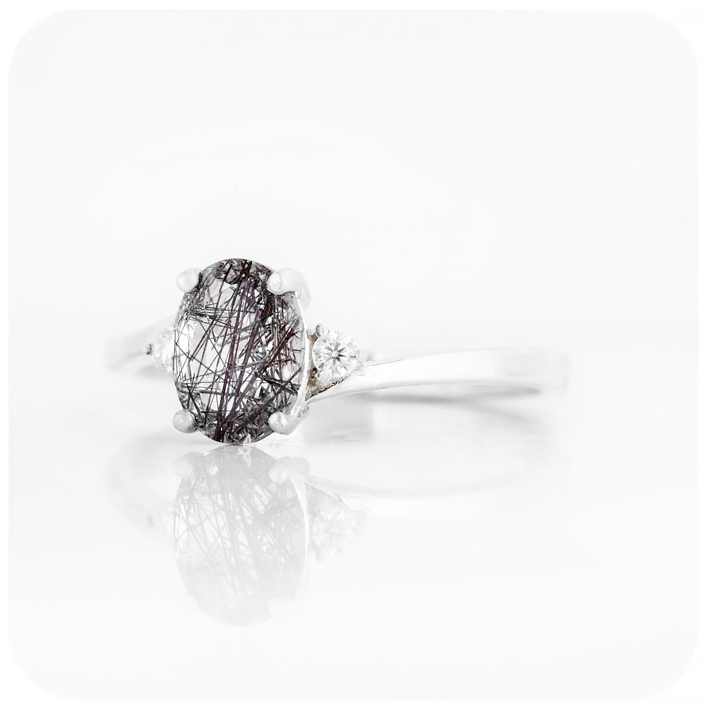 Oval cut Black Rutile and Moissanite Trilogy Ring with a Twist - 8x6mm