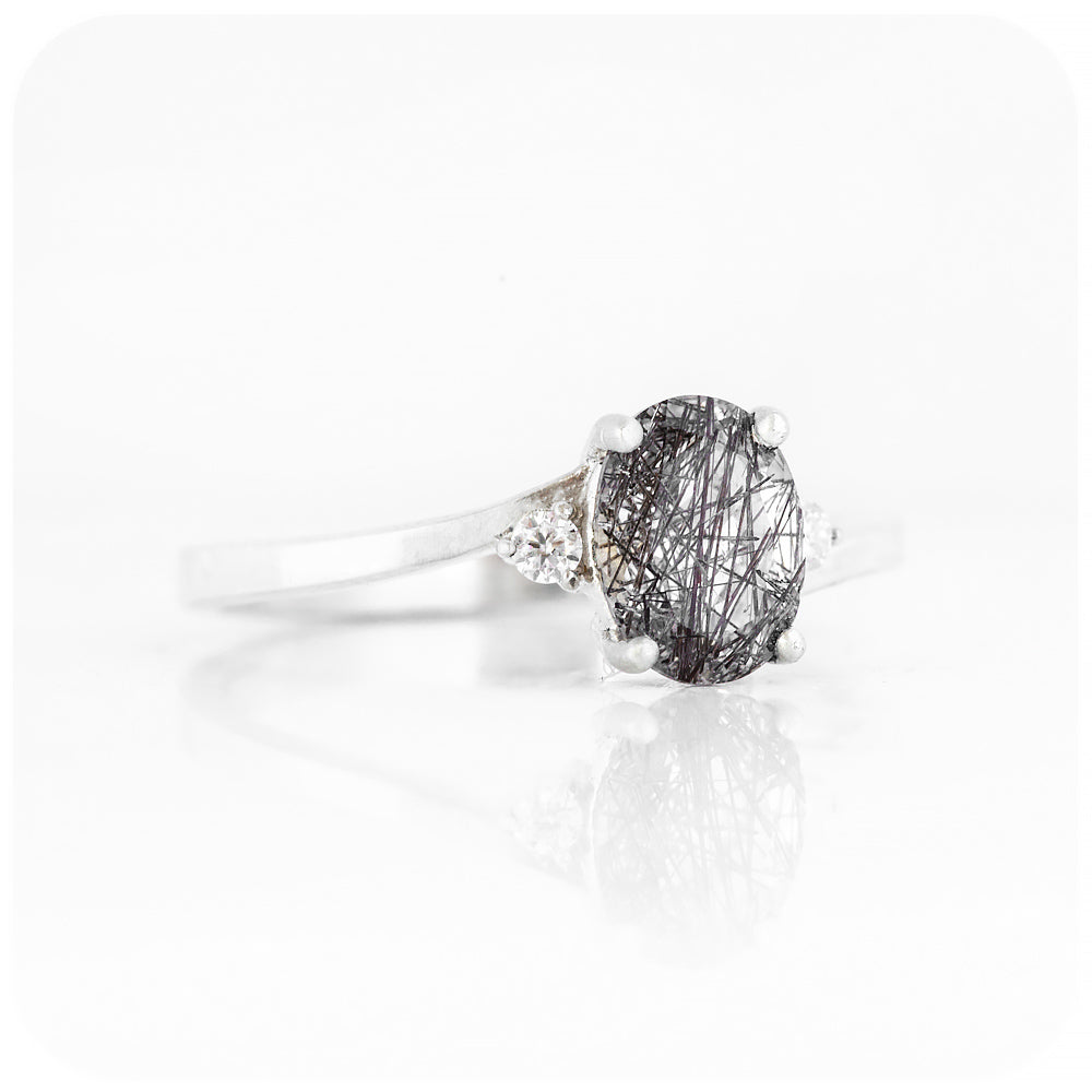 Oval cut Black Rutile and Moissanite Trilogy Ring with a Twist - 8x6mm