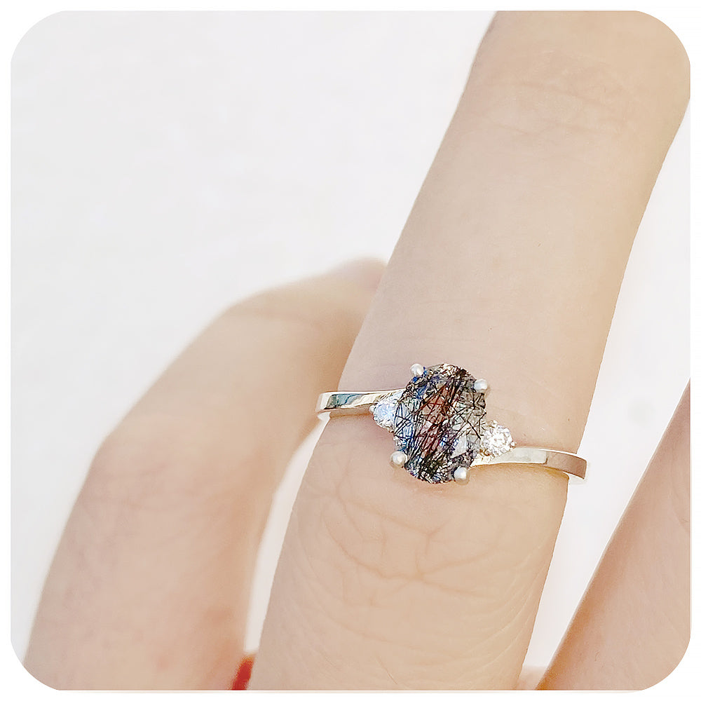 Oval cut Black Rutile and Moissanite Trilogy Ring with a Twist - 8x6mm