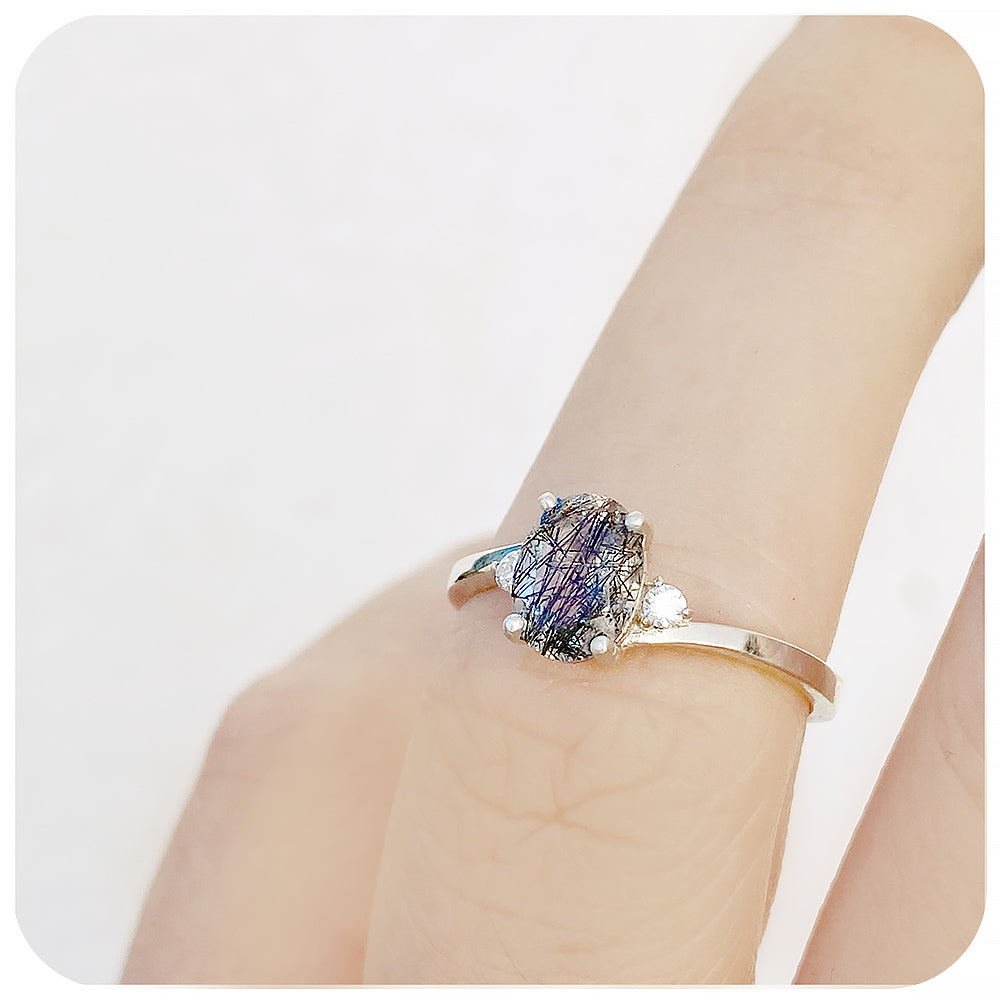 Oval cut Black Rutile and Moissanite Trilogy Ring with a Twist - 8x6mm