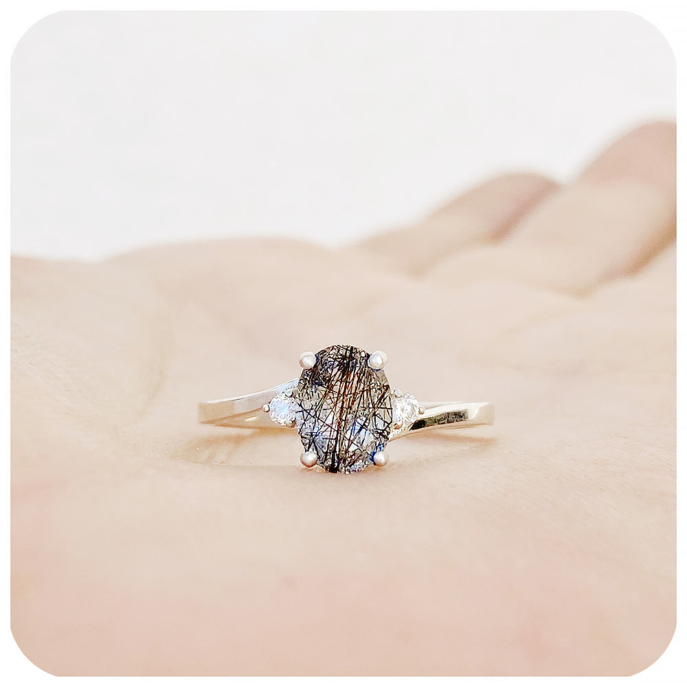 Oval cut Black Rutile and Moissanite Trilogy Ring with a Twist - 8x6mm