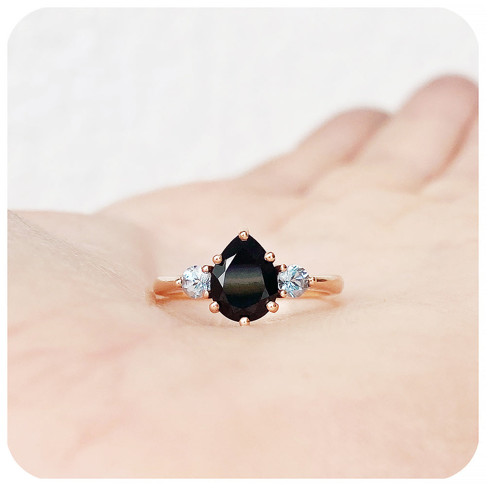 black pear cut spinel and round cut aquamarine trilogy style engagement ring in rose gold - Victoria's Jewellery