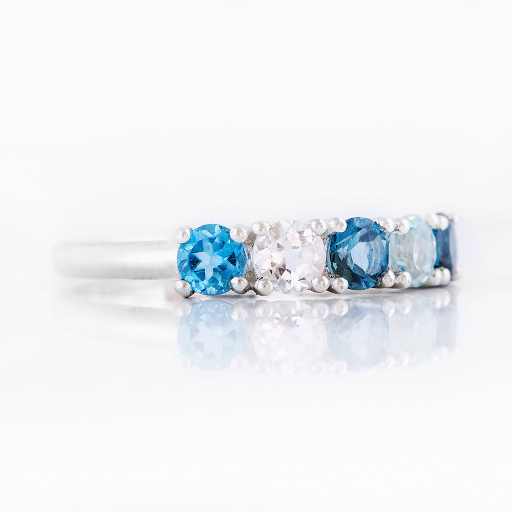 Round cut Blue Topaz half eternity anniversary ring - Victoria's Jewellery