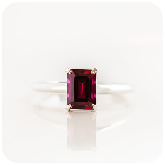 Mari, an Emerald cut Rhodolite Solitaire Ring