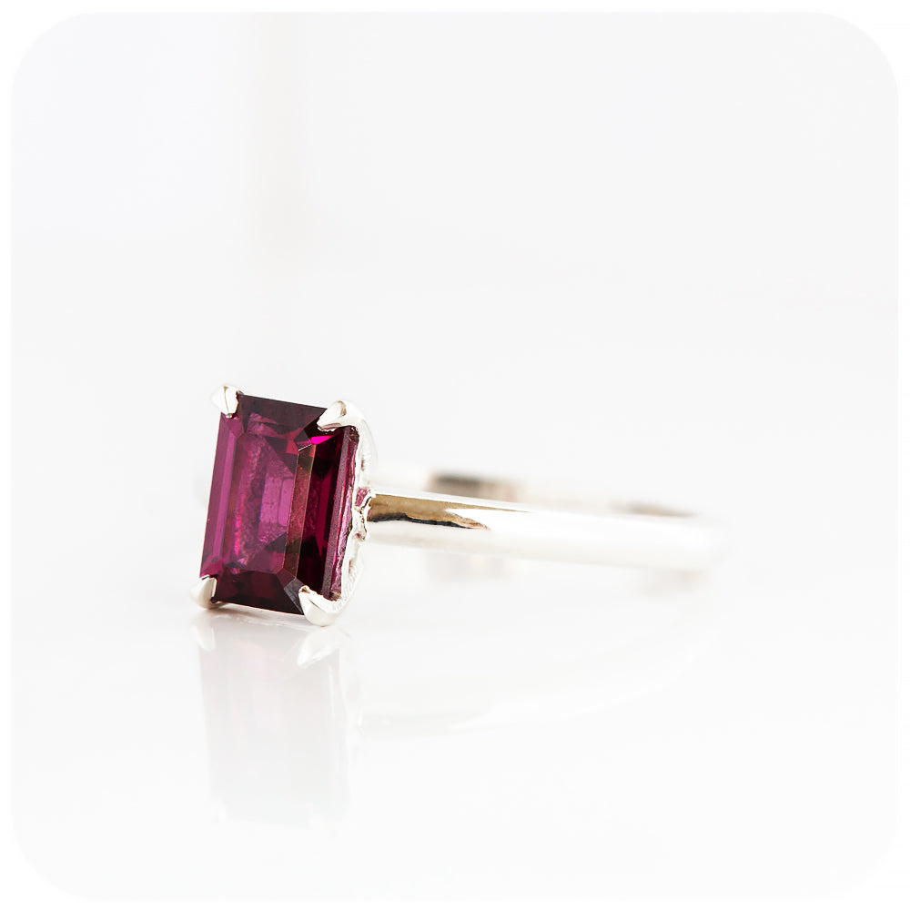 Mari, an Emerald cut Rhodolite Solitaire Ring