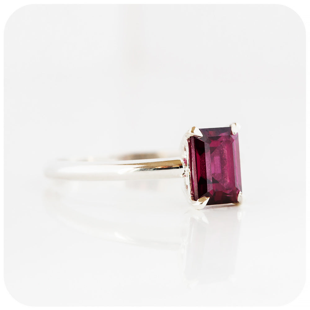 Mari, an Emerald cut Rhodolite Solitaire Ring