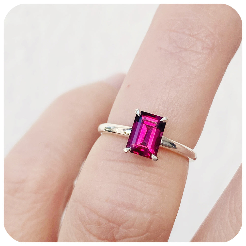 Mari, an Emerald cut Rhodolite Solitaire Ring
