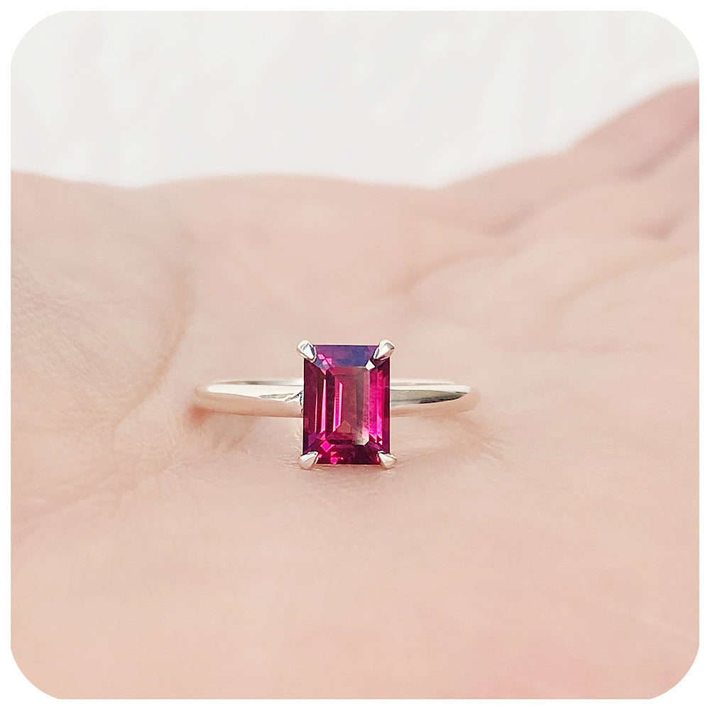 Mari, an Emerald cut Rhodolite Solitaire Ring