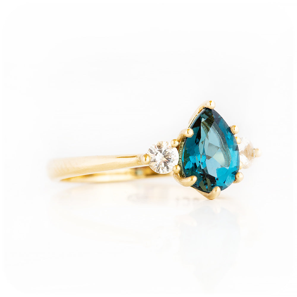 Pear cut London Blue Topaz and Diamond Trilogy Engagement Ring in Yellow Gold - Victoria's Jewellery