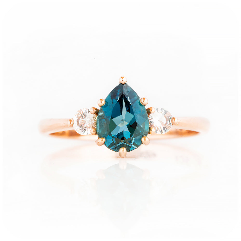 Pear cut London Blue Topaz and Diamond Trilogy Engagement Ring in Rose Gold - Victoria's Jewellery