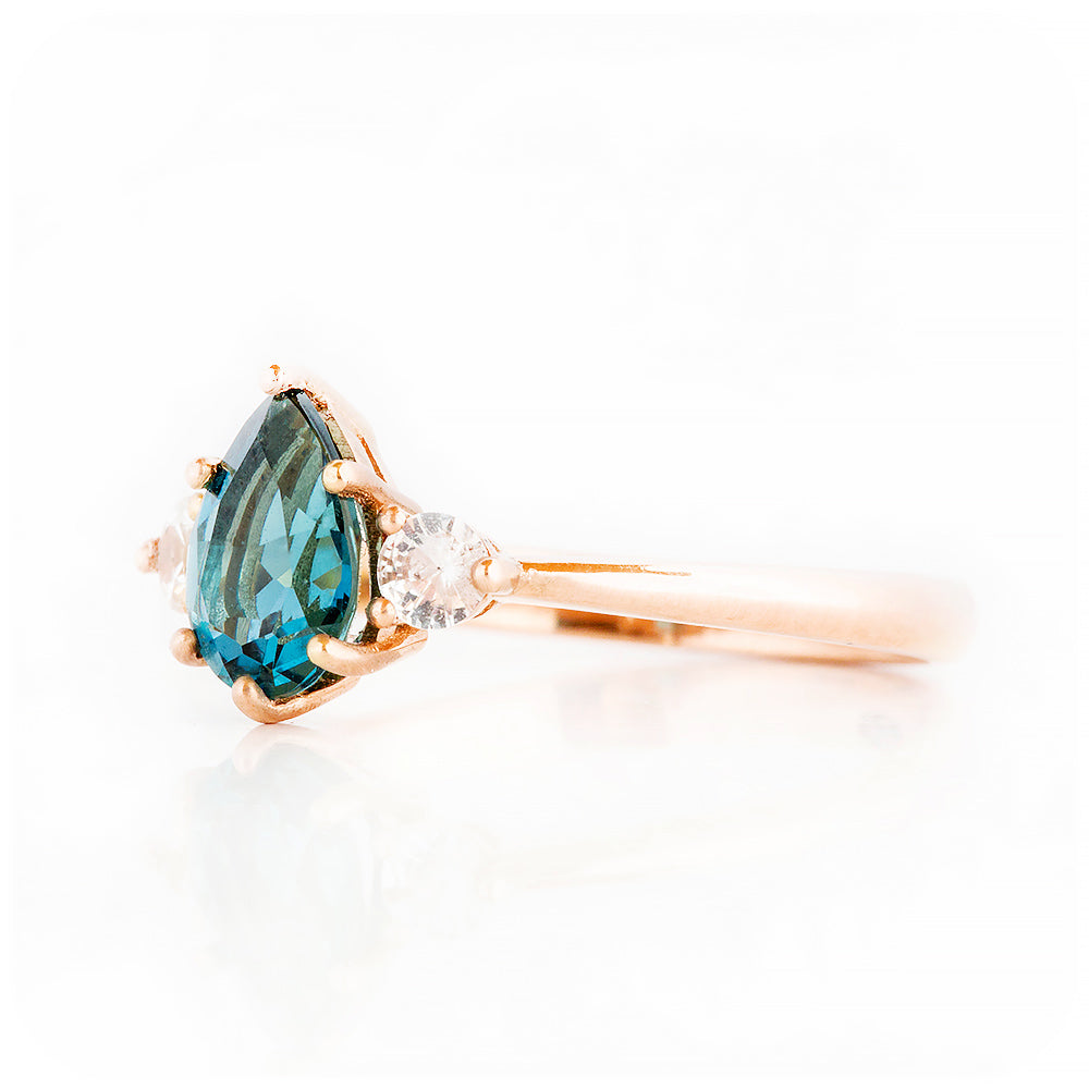 Pear cut London Blue Topaz and Diamond Trilogy Engagement Ring in Rose Gold - Victoria's Jewellery