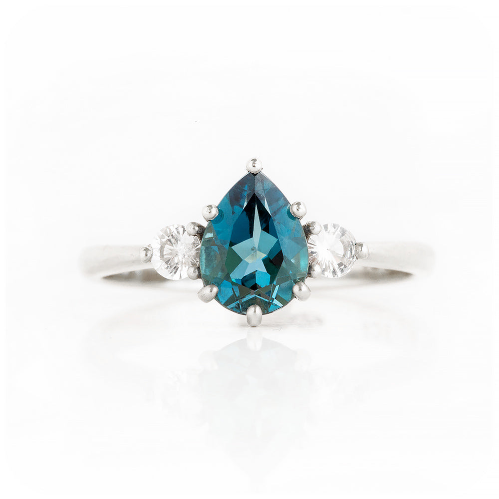Pear cut London Blue Topaz and Diamond Trilogy Engagement Ring in White Gold - Victoria's Jewellery
