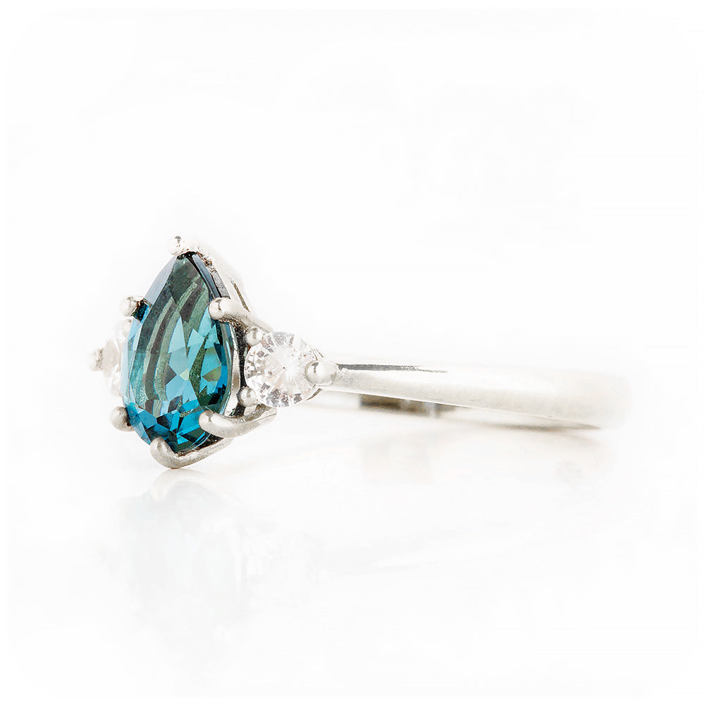 Pear cut London Blue Topaz and Diamond Trilogy Engagement Ring in White Gold - Victoria's Jewellery