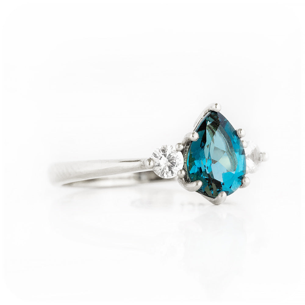 Pear cut London Blue Topaz and Diamond Trilogy Engagement Ring in White Gold - Victoria's Jewellery