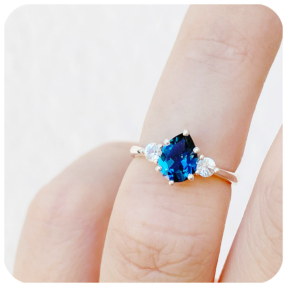 Pear cut London Blue Topaz and White Sapphire Trilogy Engagement Ring in White Gold - Victoria's Jewellery