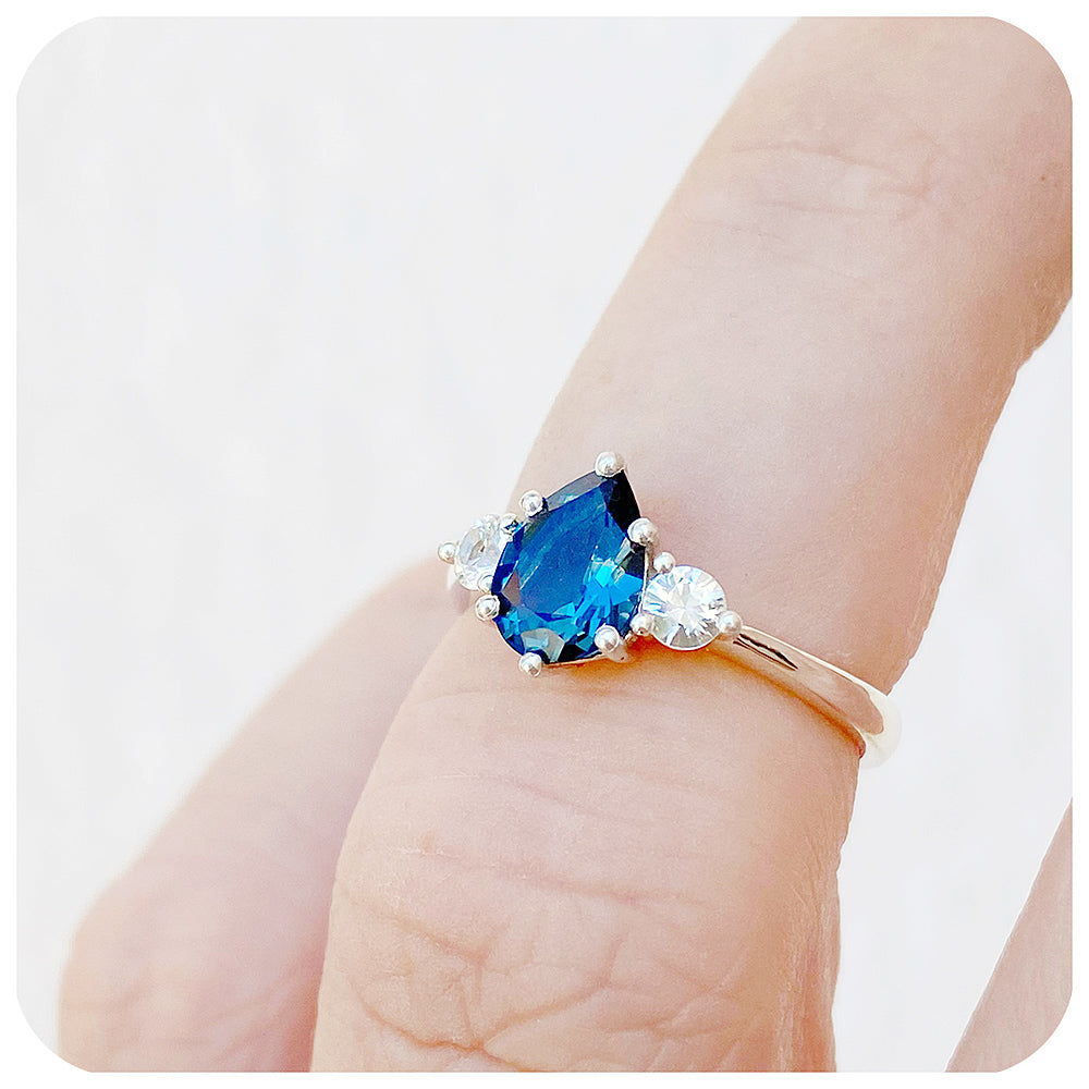 Pear cut London Blue Topaz and White Sapphire Trilogy Engagement Ring in White Gold - Victoria's Jewellery