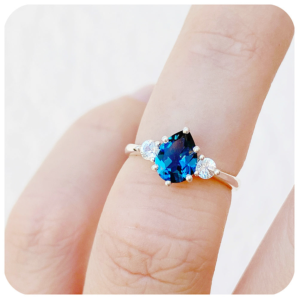 Pear cut London Blue Topaz and White Sapphire Trilogy Engagement Ring in White Gold - Victoria's Jewellery
