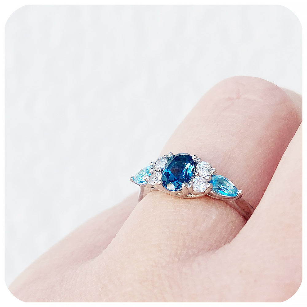 sapphire and topaz anniversary or engagement ring with trellis design
