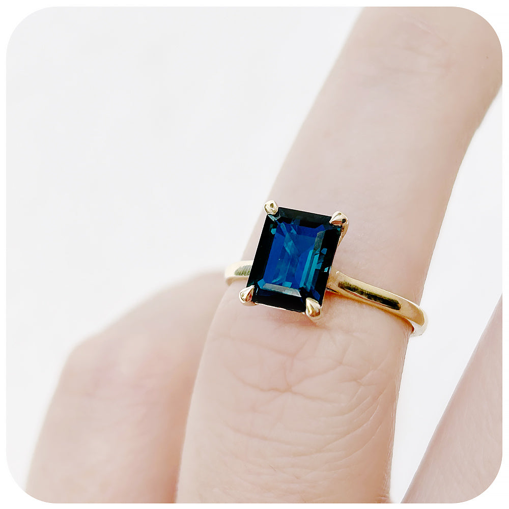 Emerald cut London Blue Topaz Solitaire Ring in Yellow Gold - Victoria's Jewellery