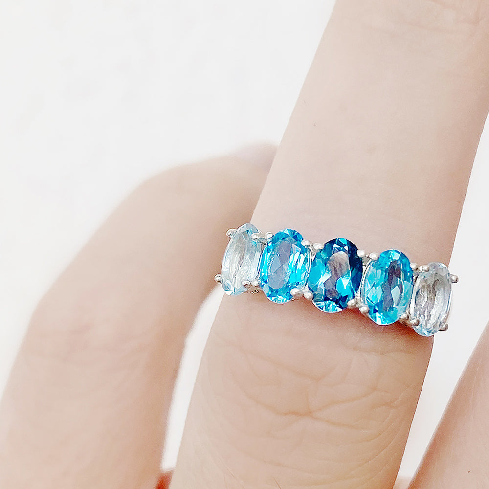Oval cut Blue Topaz Rainbow half eternity ring - Victoria's Jewellery