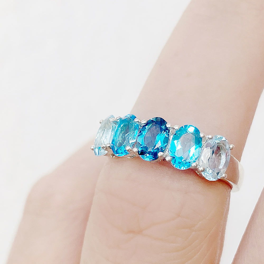 Oval cut Blue Topaz Rainbow half eternity ring - Victoria's Jewellery