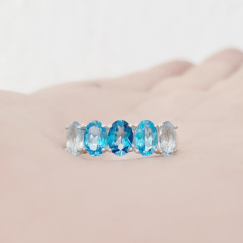 Oval cut Blue Topaz Rainbow half eternity ring - Victoria's Jewellery