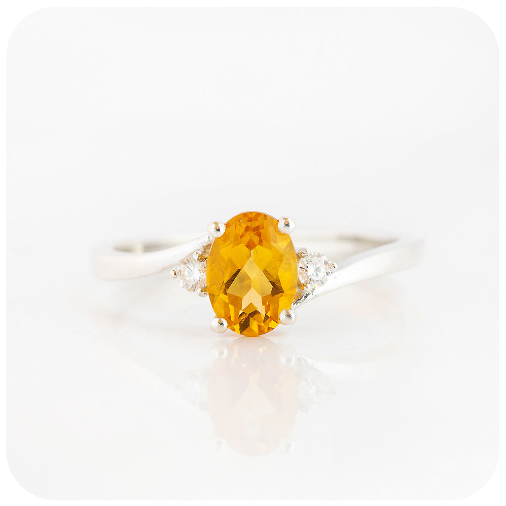 Oval cut Citrine and Moissanite Trilogy Ring with a Twist