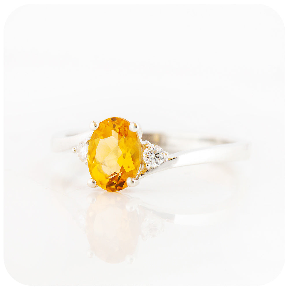Oval cut Citrine and Moissanite Trilogy Ring with a Twist