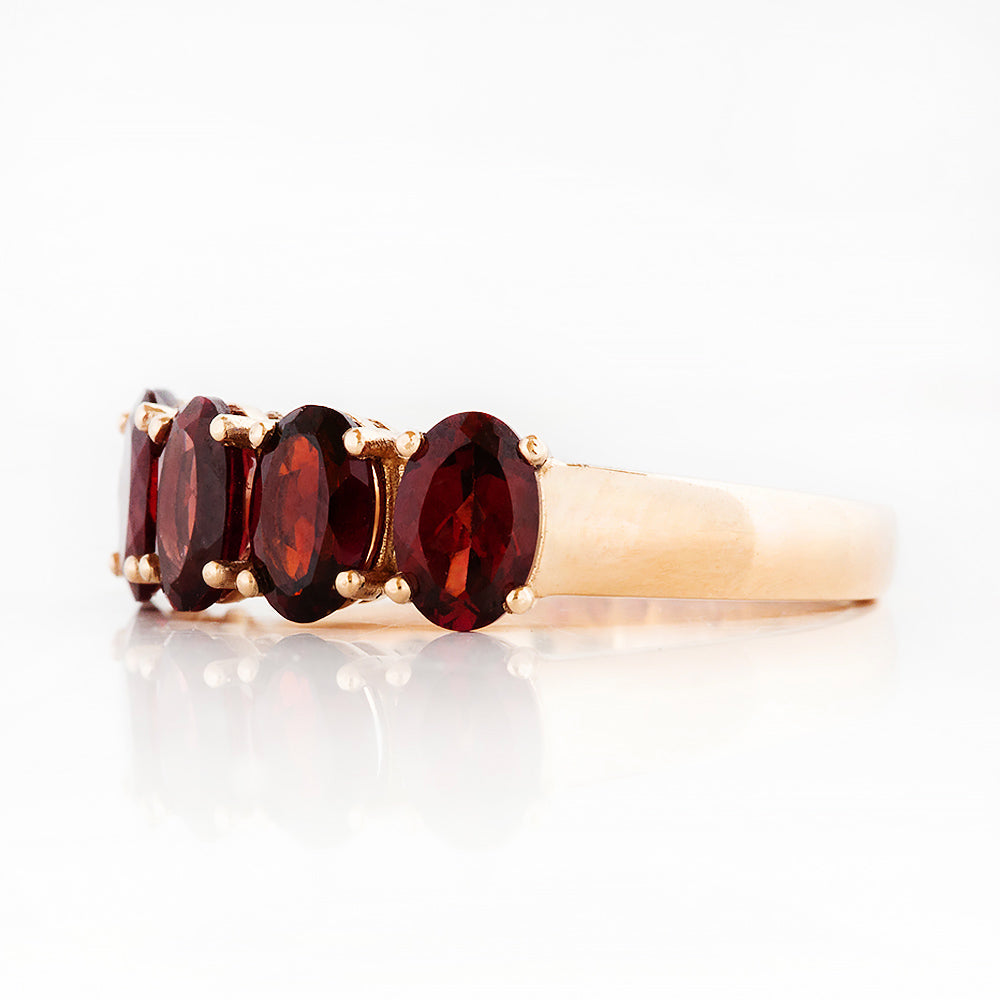 Oval cut Garnet Half Eternity Ring in Rose Gold - Victoria's Jewellery