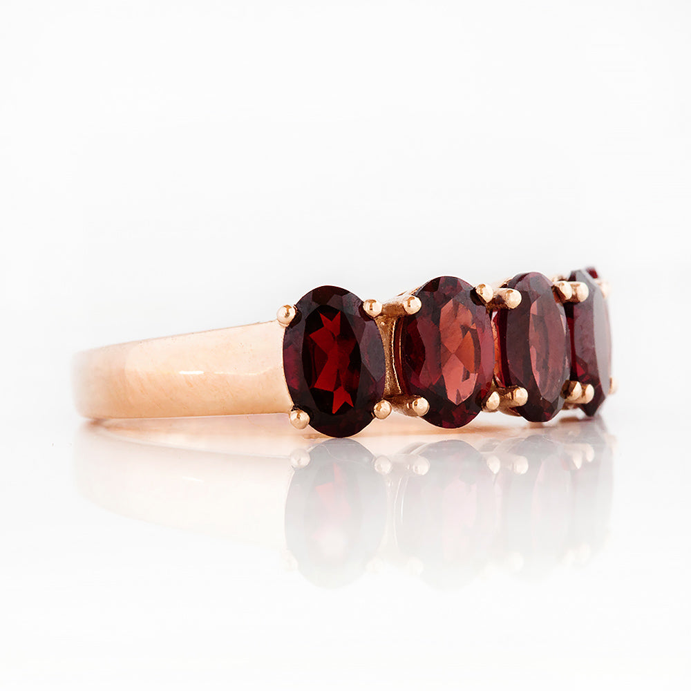Oval cut Garnet Half Eternity Ring in Rose Gold - Victoria's Jewellery