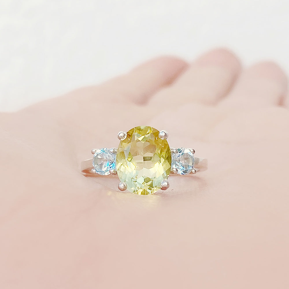 Hallie, an Oval cut Lemon Quartz and Topaz Trilogy Ring