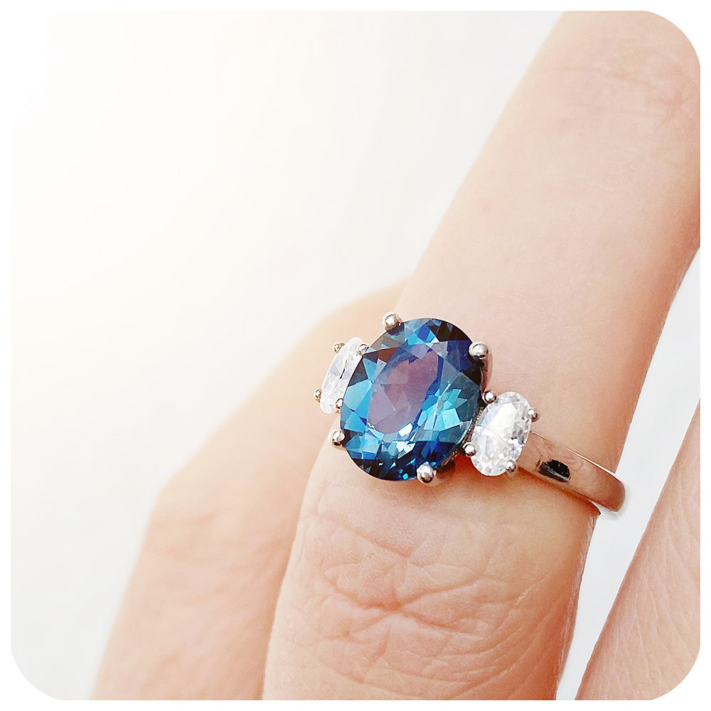 teal london blue topaz and moissanite oval cut trilogy engagement ring - Victoria's Jewellery