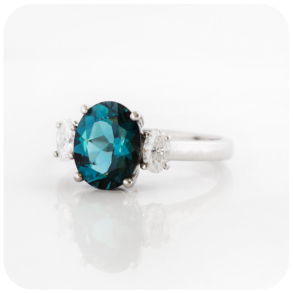 teal london blue topaz and moissanite oval cut trilogy engagement ring - Victoria's Jewellery