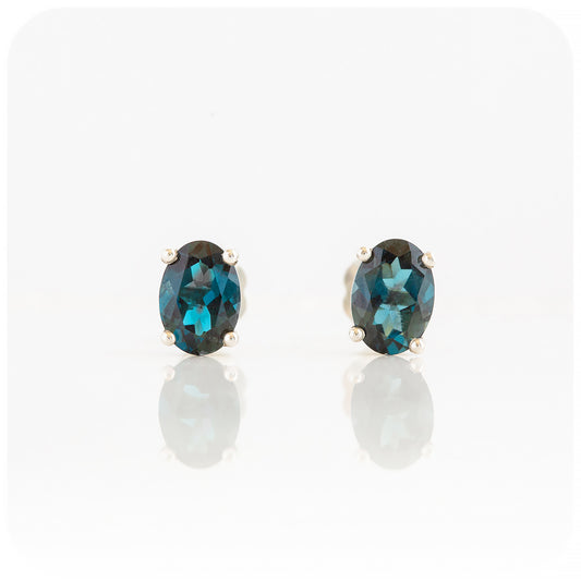 oval cut teal london blue topaz stud earrings in sterling silver
