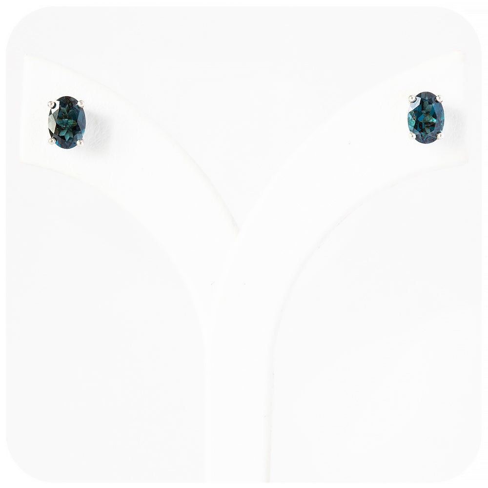oval cut teal london blue topaz stud earrings in sterling silver