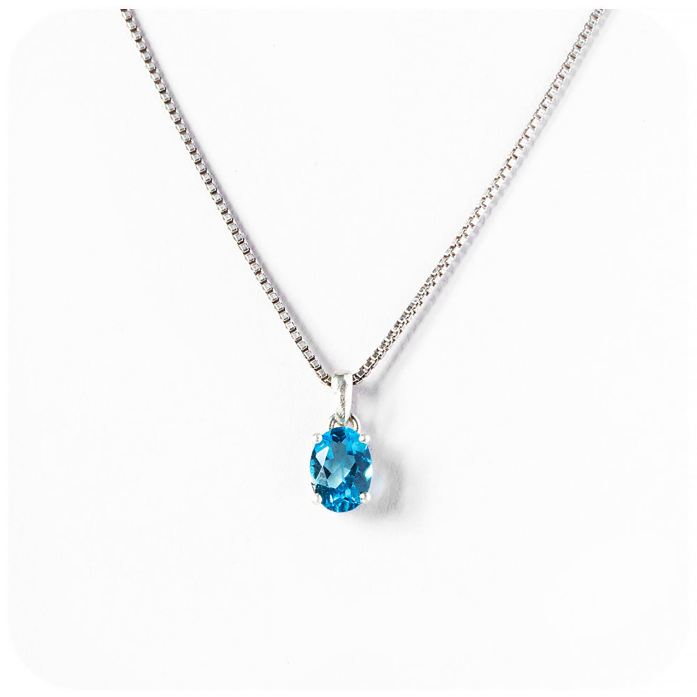 Luna, an Oval cut Swiss Blue Topaz Pendant and Chain