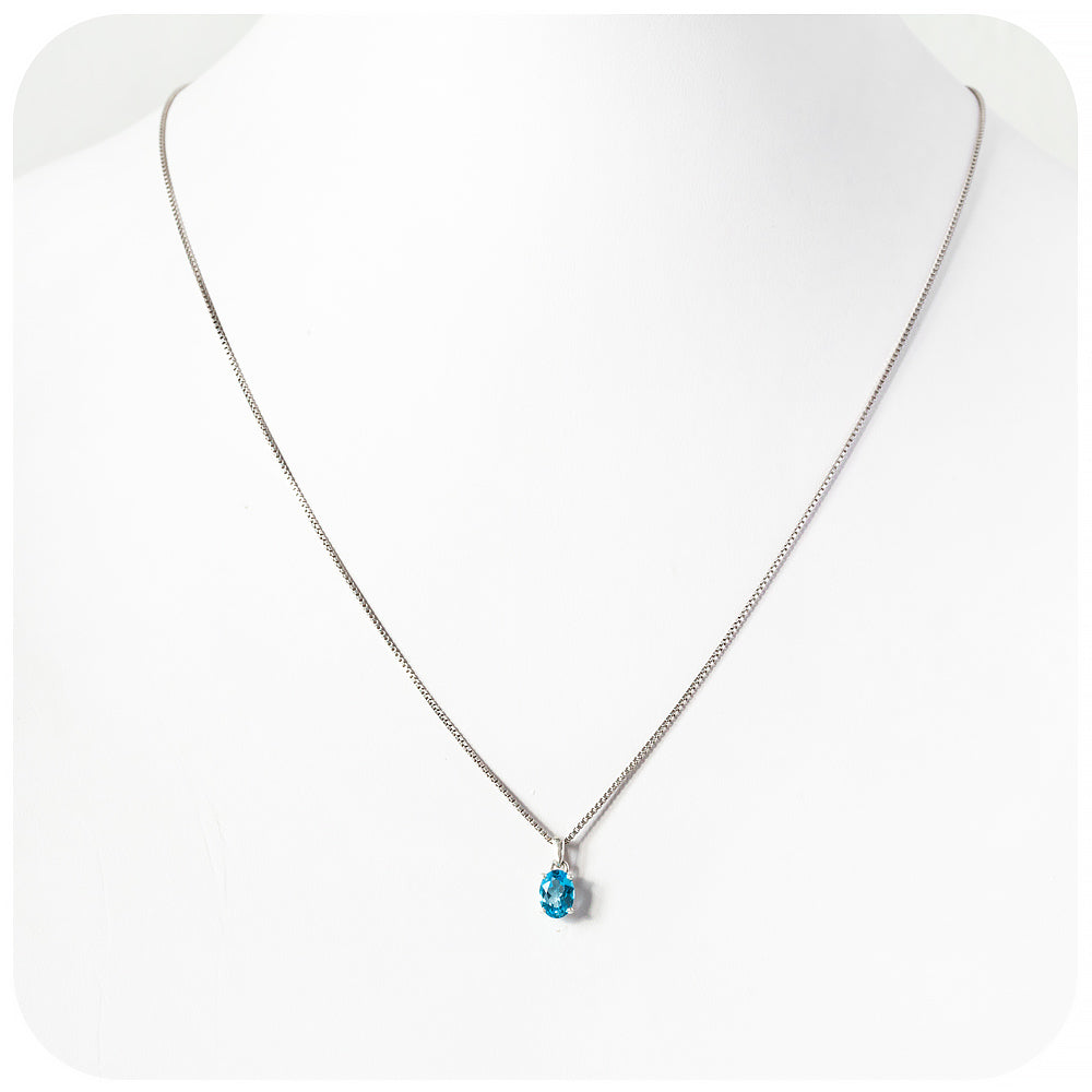 Luna, an Oval cut Swiss Blue Topaz Pendant and Chain
