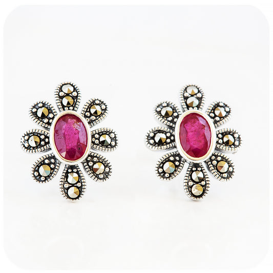 oval cut ruby stud earrings in a vintage flower design