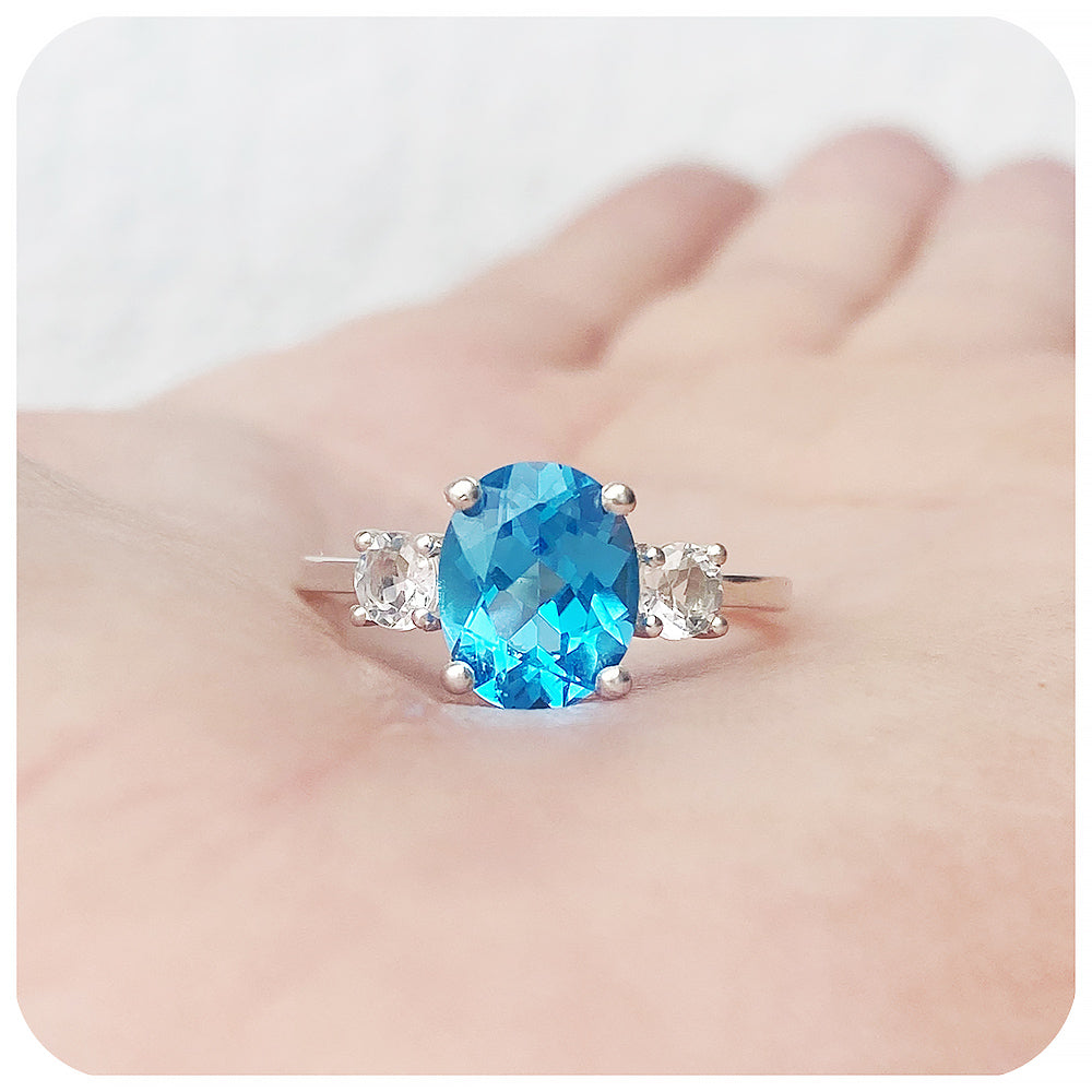 Oval cut Swiss Blue Topaz and White Quartz Trilogy Anniversary Ring - Victoria's Jewellery