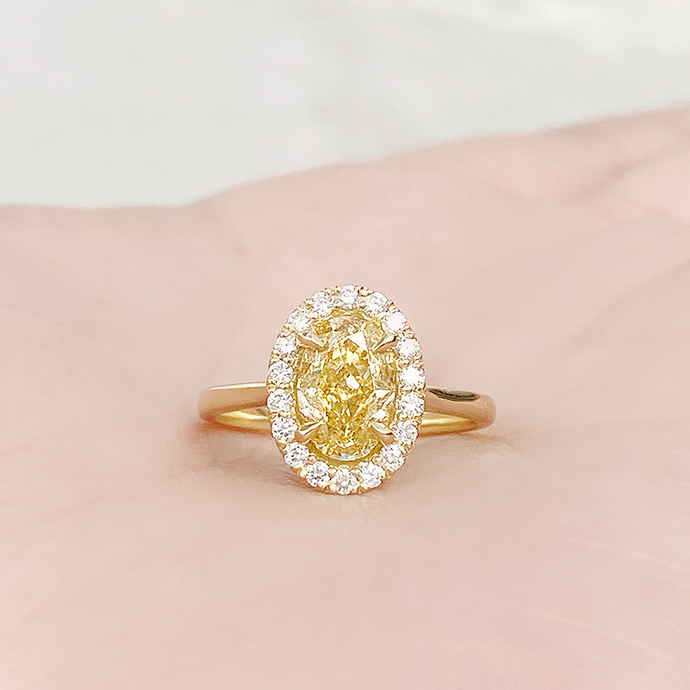 Tilana, an Oval cut Yellow Diamond Halo Engagement Ring - 1.5ct
