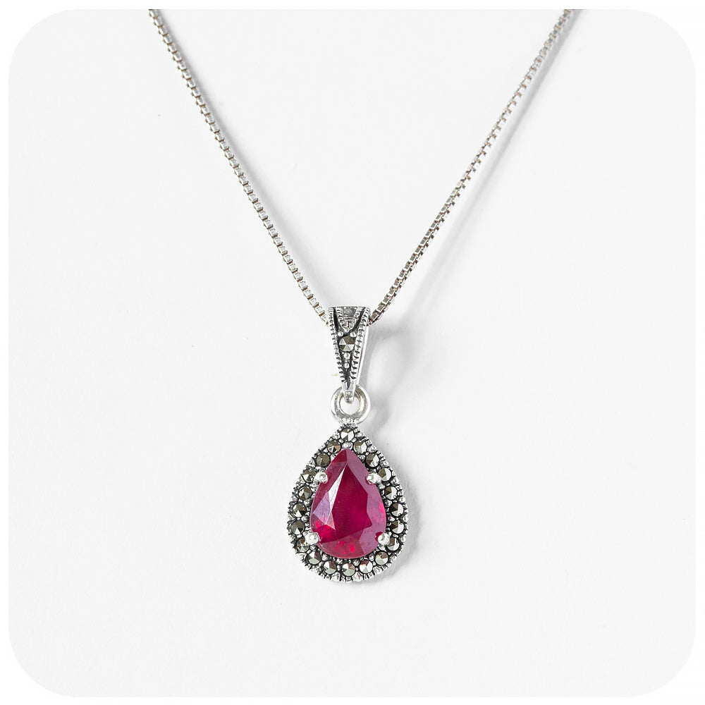 Pear cut Ruby Halo Pendant in Sterling Silver