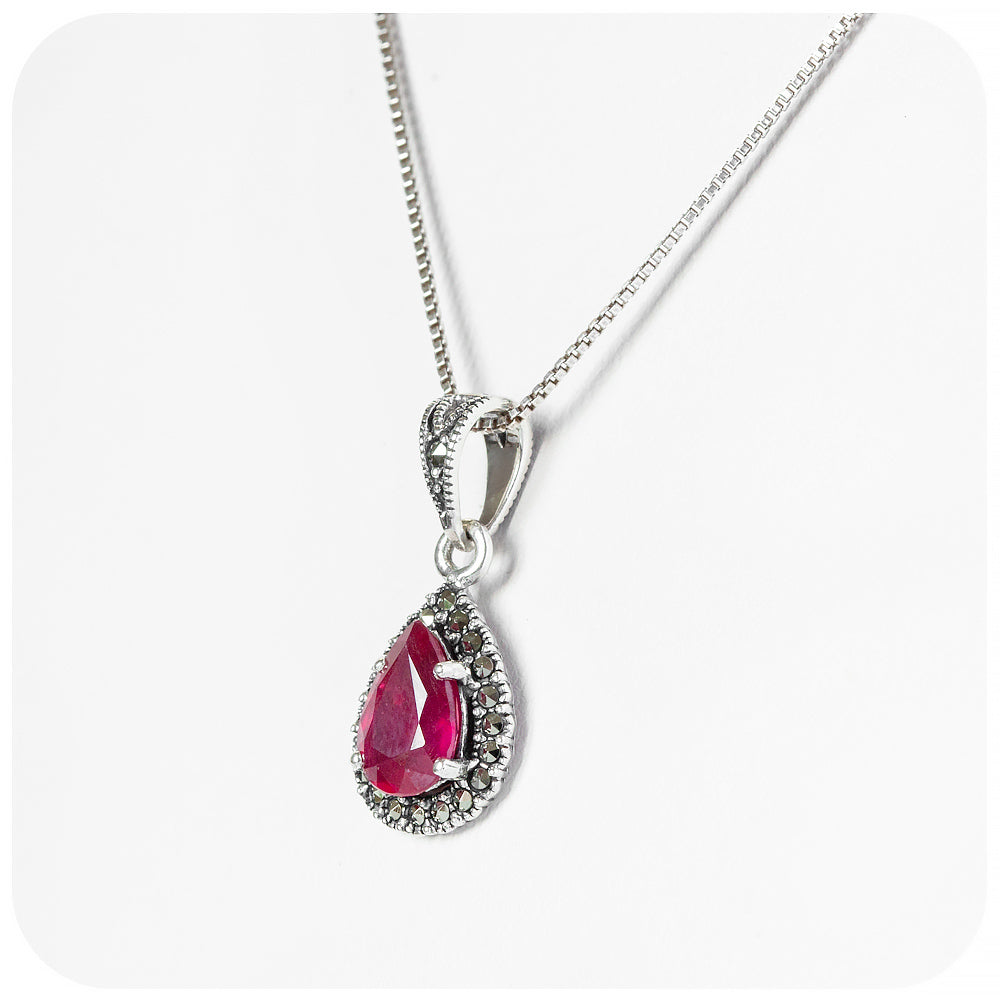 Pear cut Ruby Halo Pendant in Sterling Silver