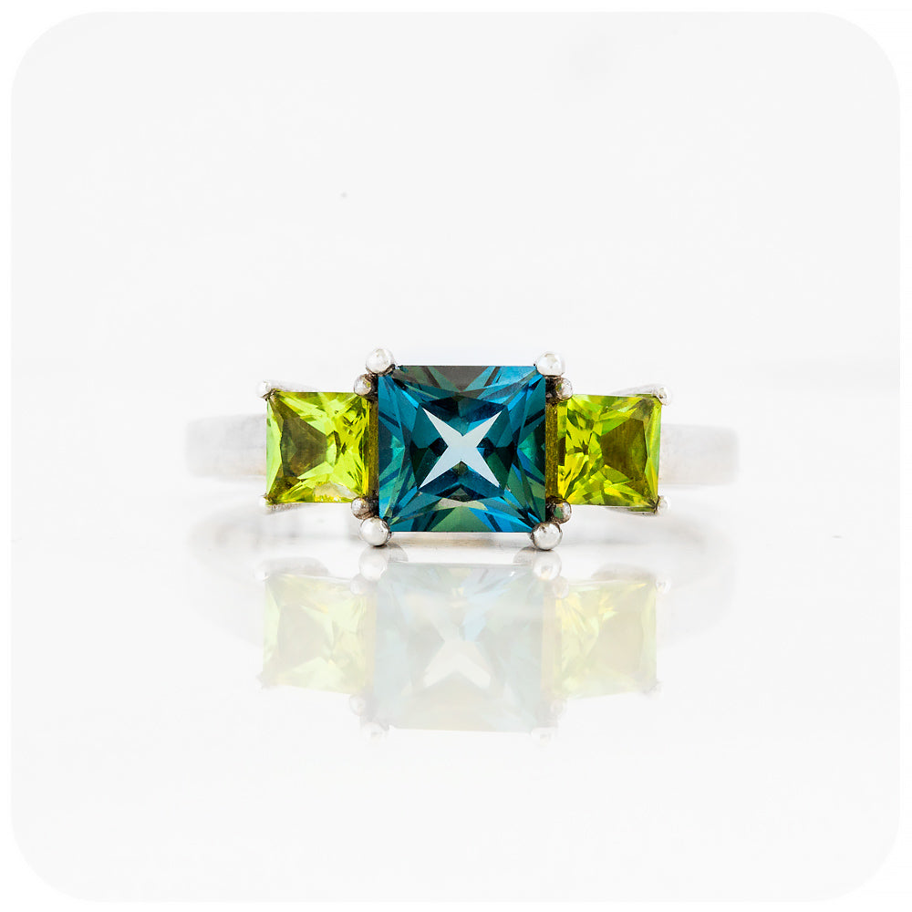 Princess cut London Blue Topaz and Peridot Trilogy Ring - Victoria's Jewellery