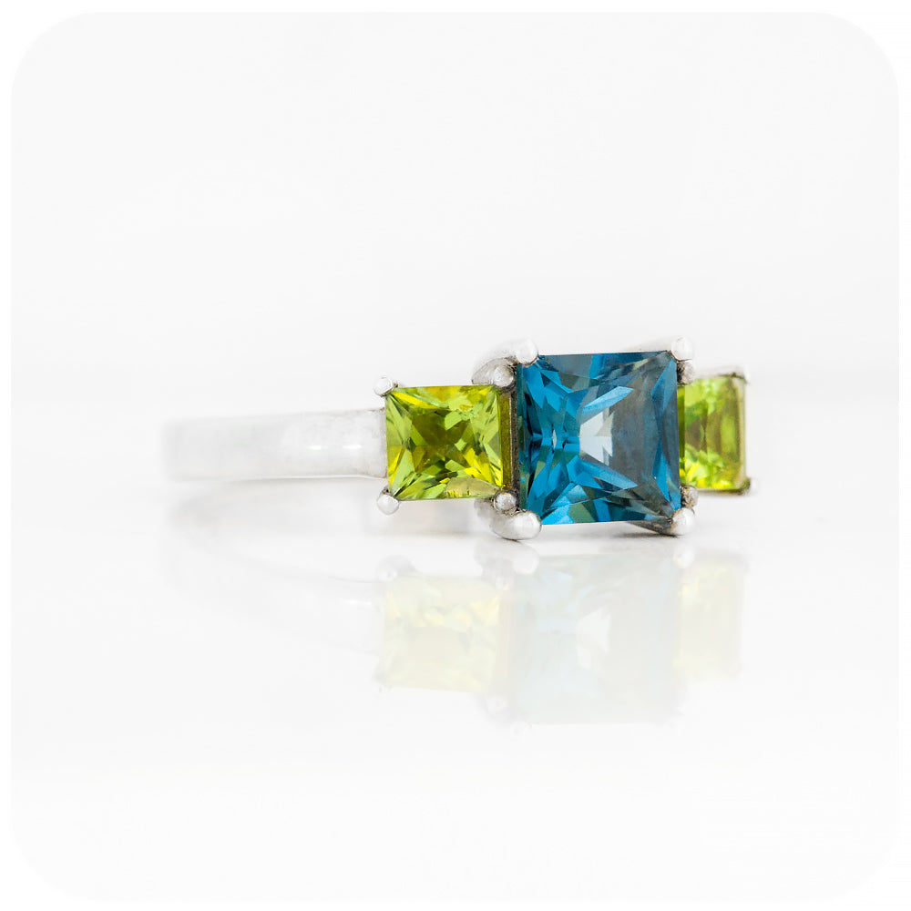 Princess cut London Blue Topaz and Peridot Trilogy Ring - Victoria's Jewellery