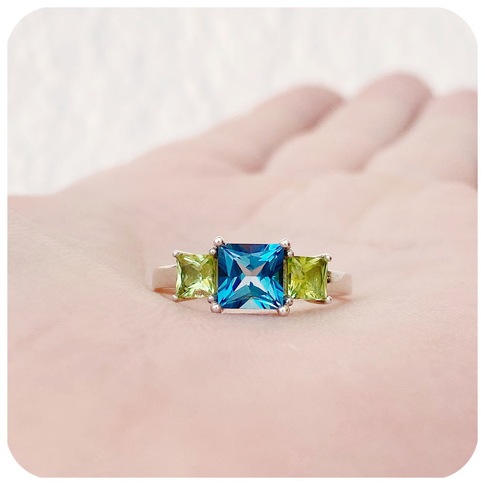 Princess cut London Blue Topaz and Peridot Trilogy Ring - Victoria's Jewellery