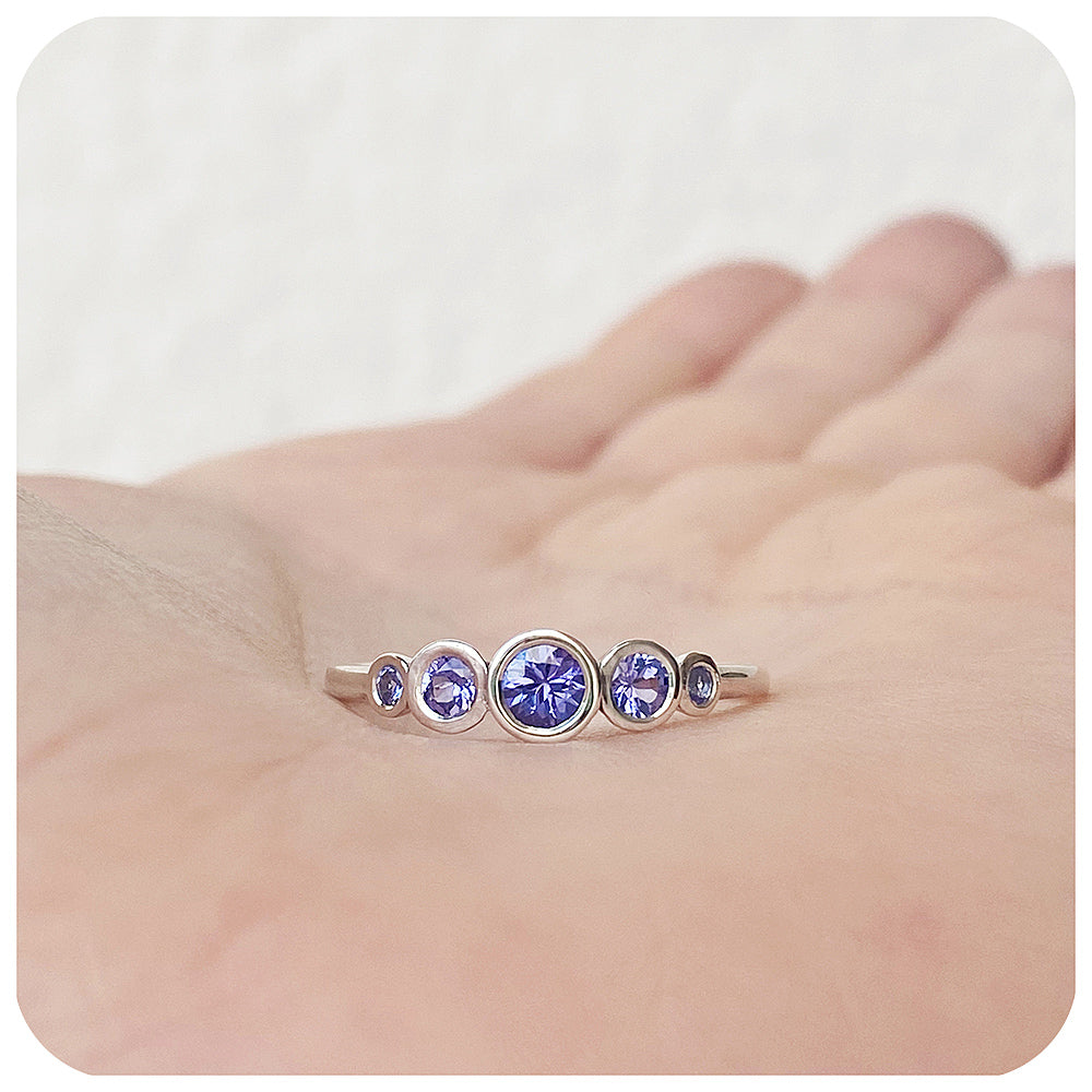 round cut tanzanite half eternity ring with graduated stones - Victoria's Jewellery