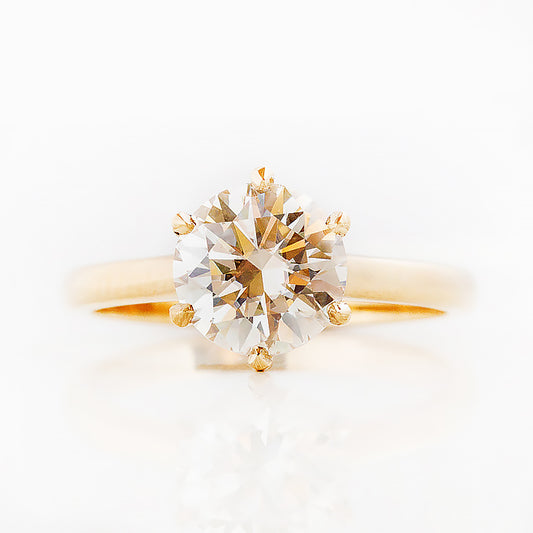 Round brilliant cut diamond solitaire engagement ring in yellow gold - Victoria's Jewellery