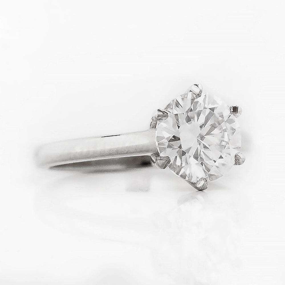 Round brilliant cut diamond solitaire engagement ring in white gold - Victoria's Jewellery